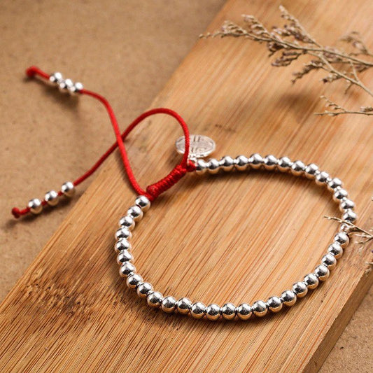 XSpiritual™ - Bracciale della Prosperità "Lu" in Argento e Corda Rossa dal Tibet